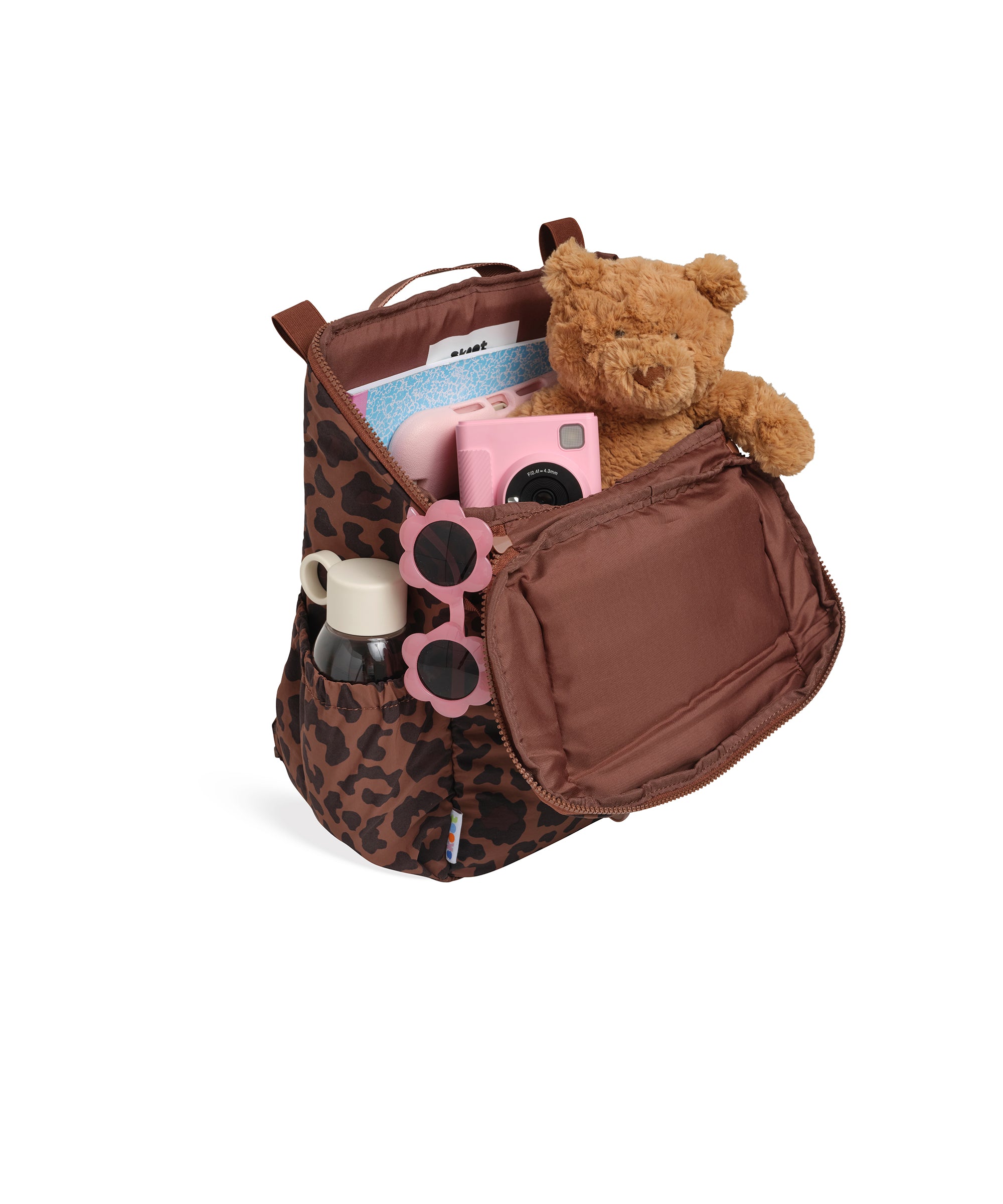 skoot leopard kids backpack outside unzipped filled up with kids toys
