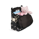 skoot polka dot kids backpack outside unzipped filled up with kids toys