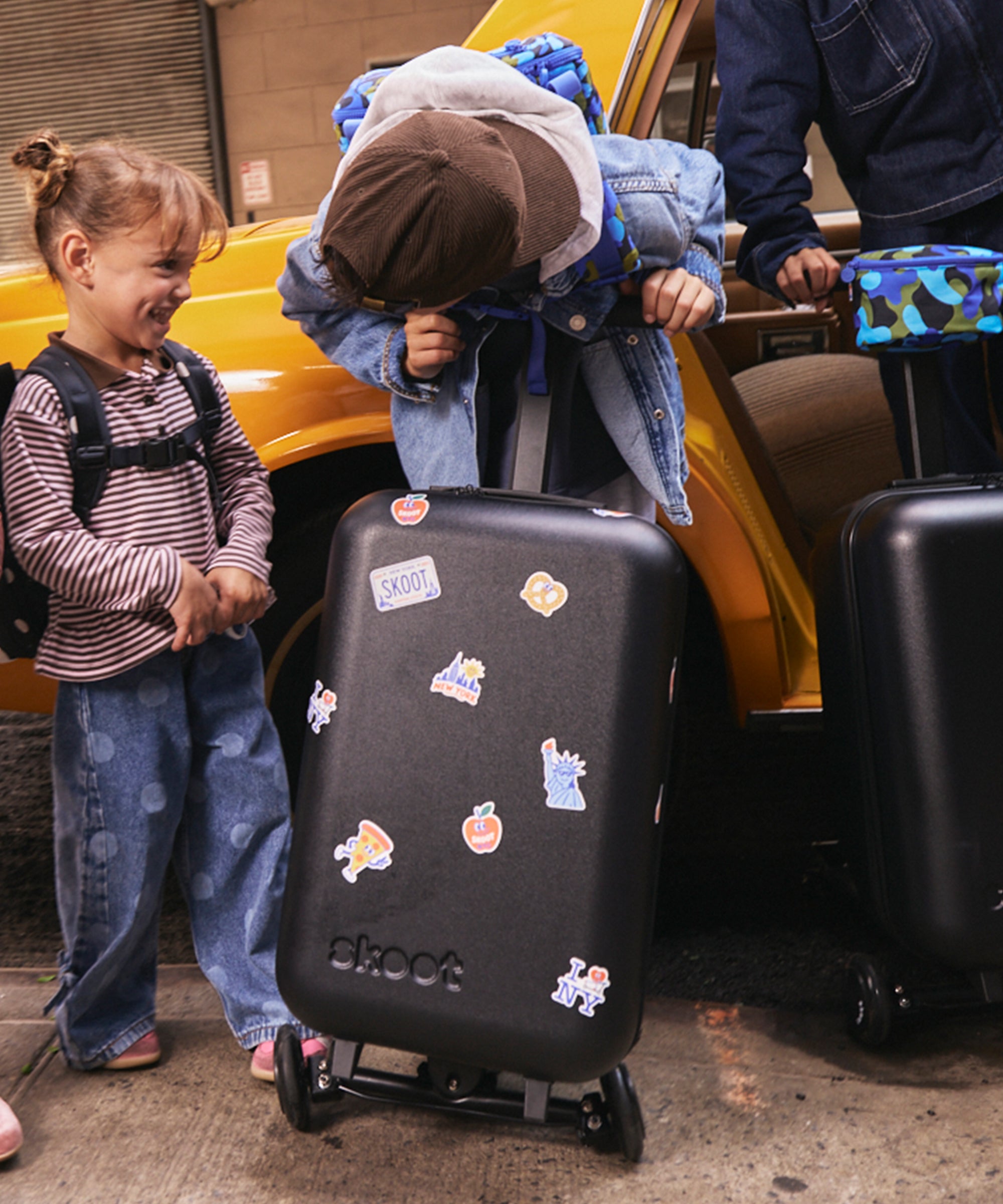 Skoot New York City Stickers on Onyx Luggage
