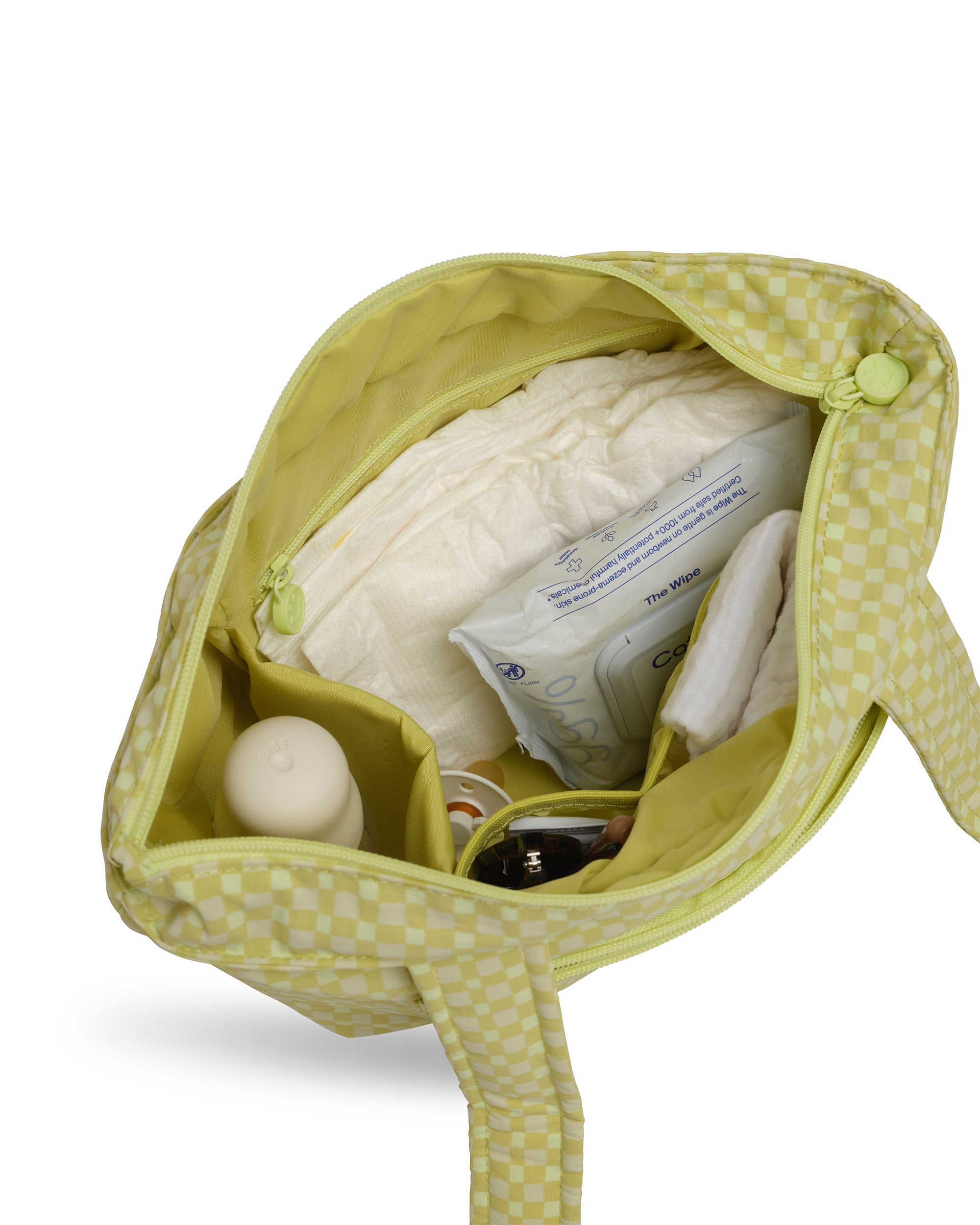 green gingham skoot stroller caddy inside packed compartments