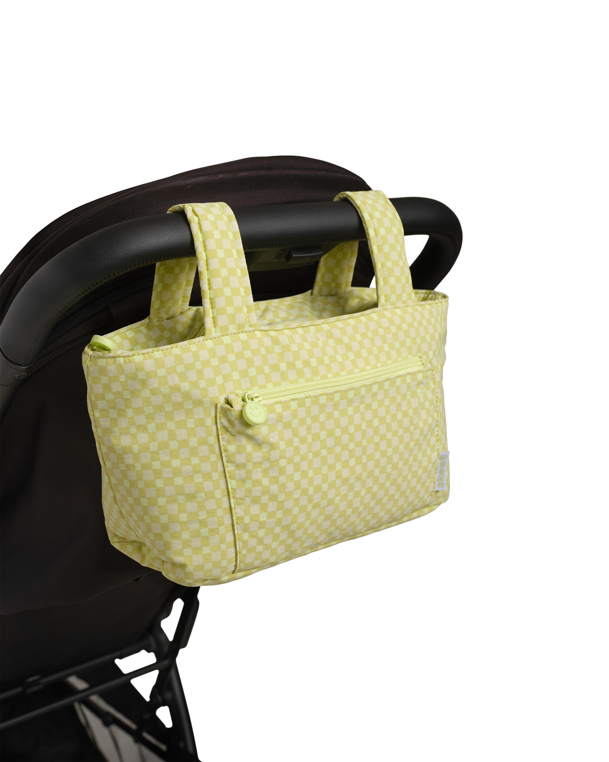 green gingham skoot stroller caddy attached to a stroller