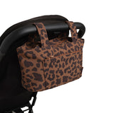 leopard skoot stroller caddy attached to a stroller
