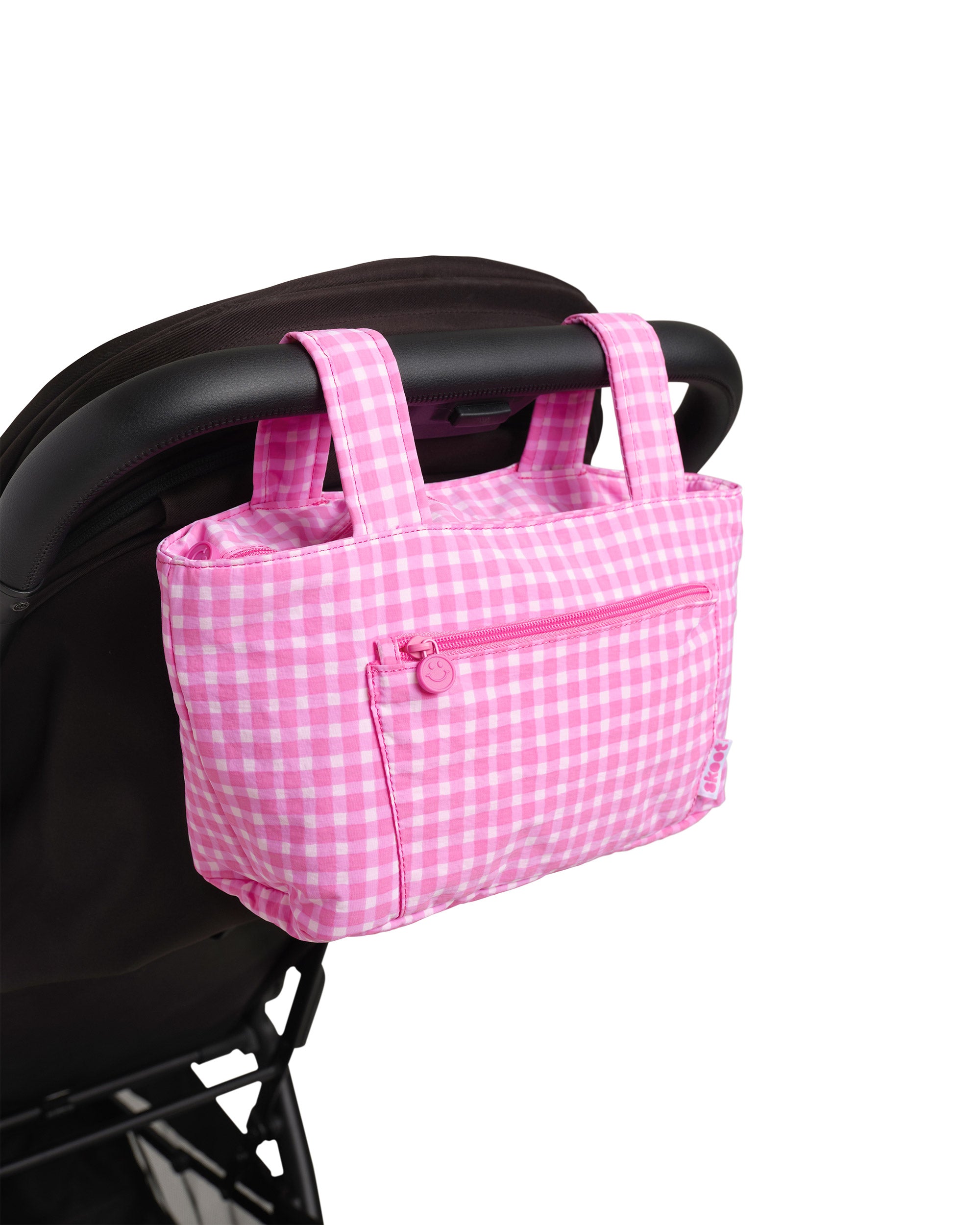 pink gingham skoot stroller caddy attached to a stroller