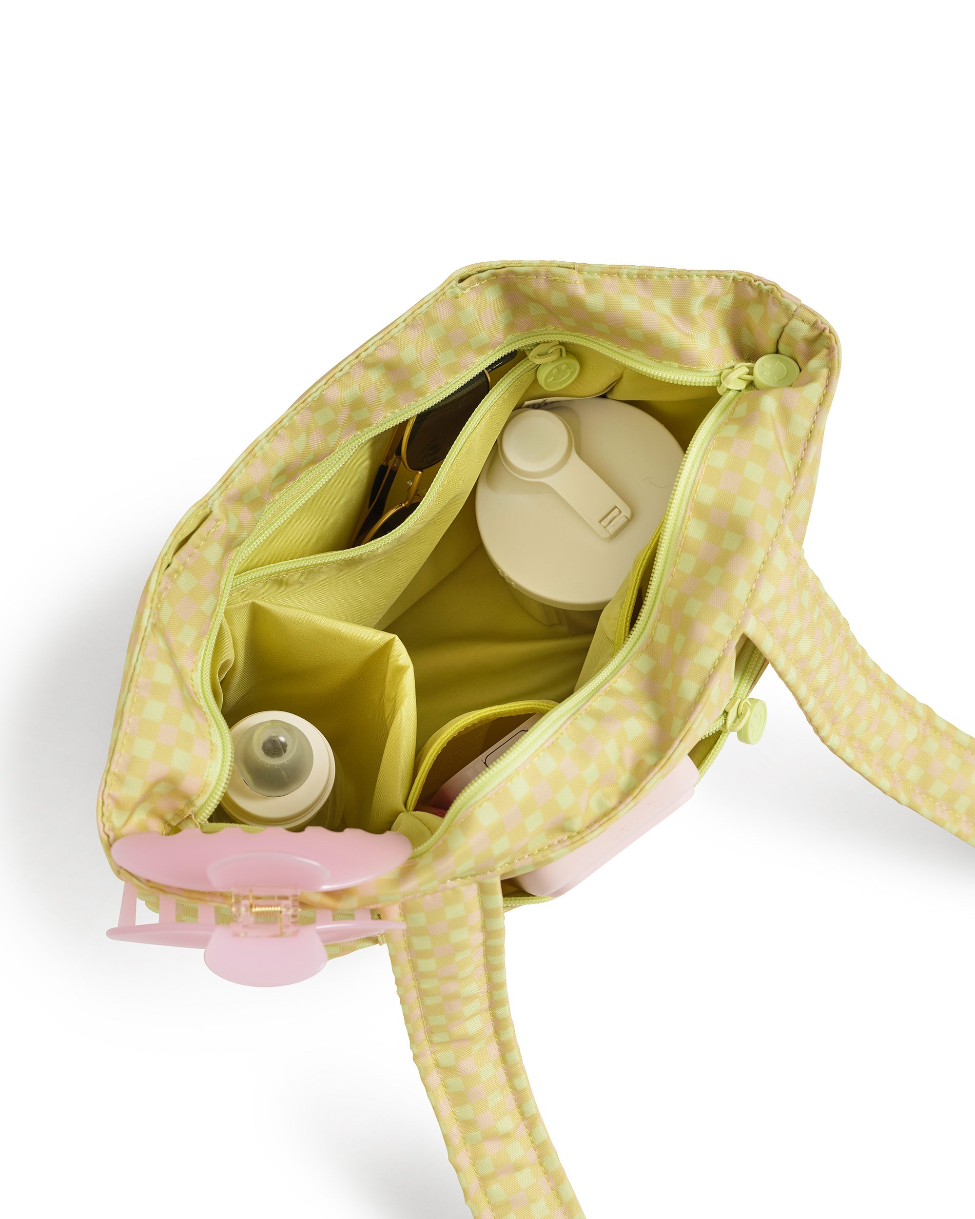 green gingham skoot stroller caddy inside packed compartments