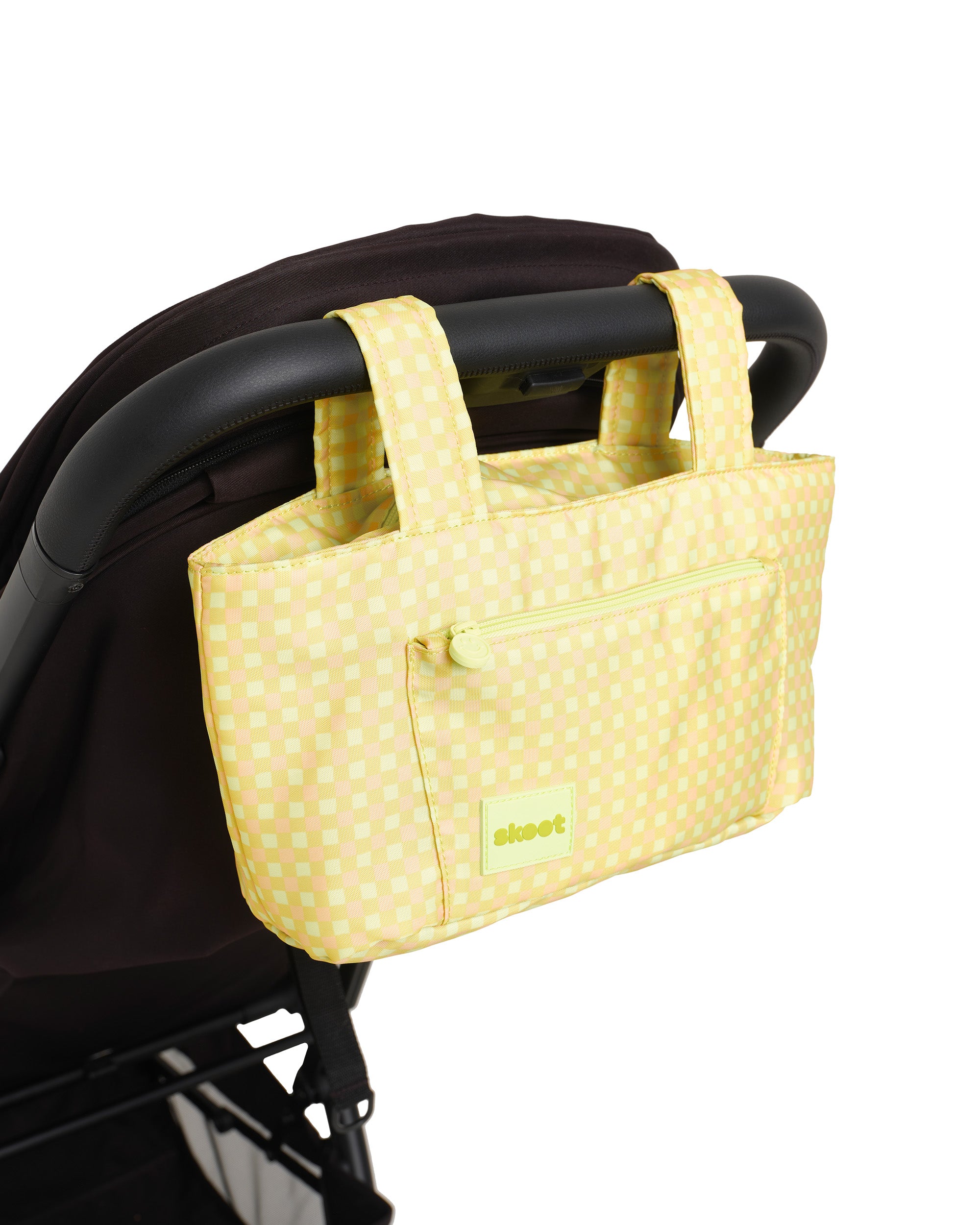 green gingham skoot stroller caddy attached to a stroller