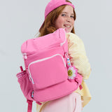 girl wearing kids pop pink backpack