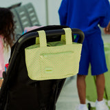skoot green gingham blue gingham pink gingham stroller caddy hanging on stroller in airport