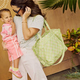 Madi Nelson holding the green gingham tote bag
