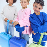 Three children with blue suitcases on a white background jet blue zip pouch blue/green gingham zip pouch pink gingham zip pouch