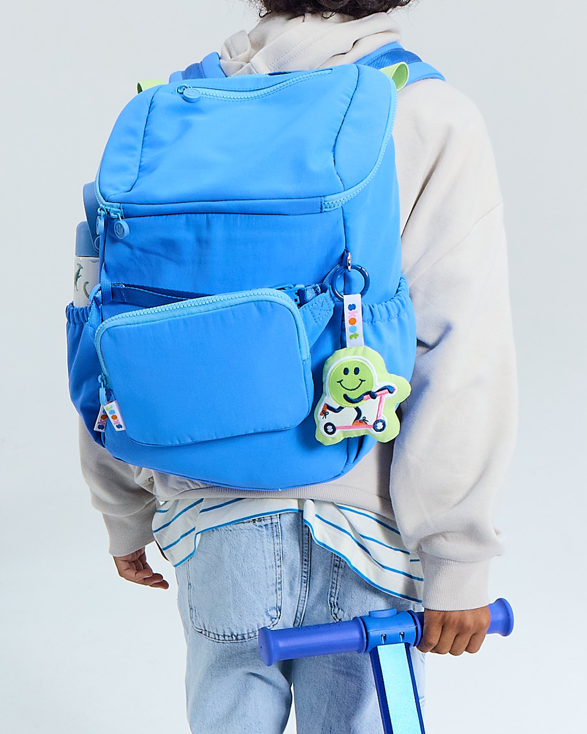 skoot kid wearing jet blue backpack