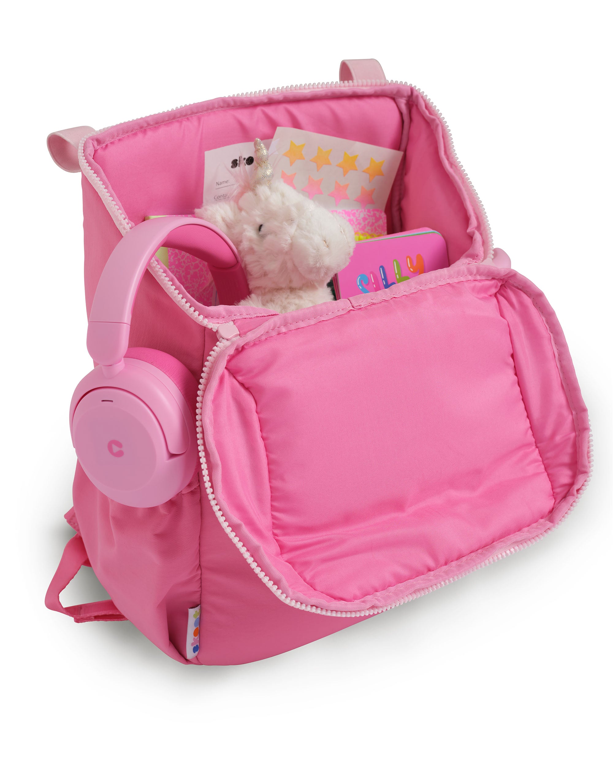 skoot pop pink kids backpack outside unzipped filled up with kids toys