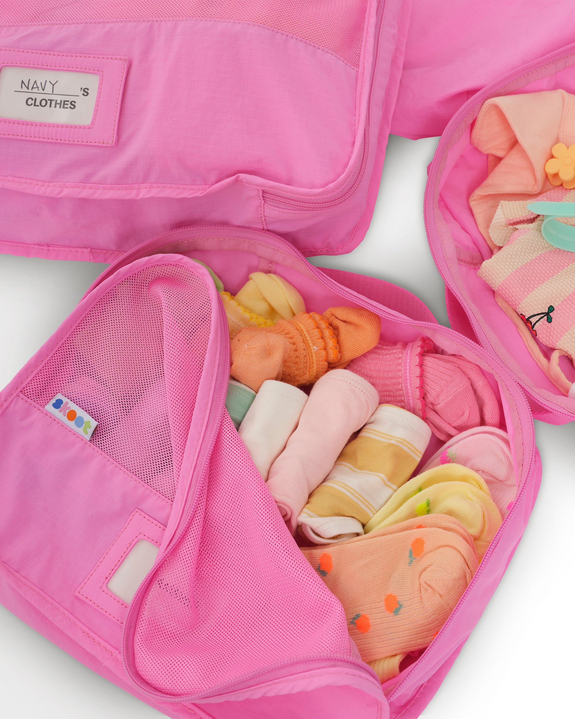 skoot pop pink packing cubes group set packed zipped and unzipped detail