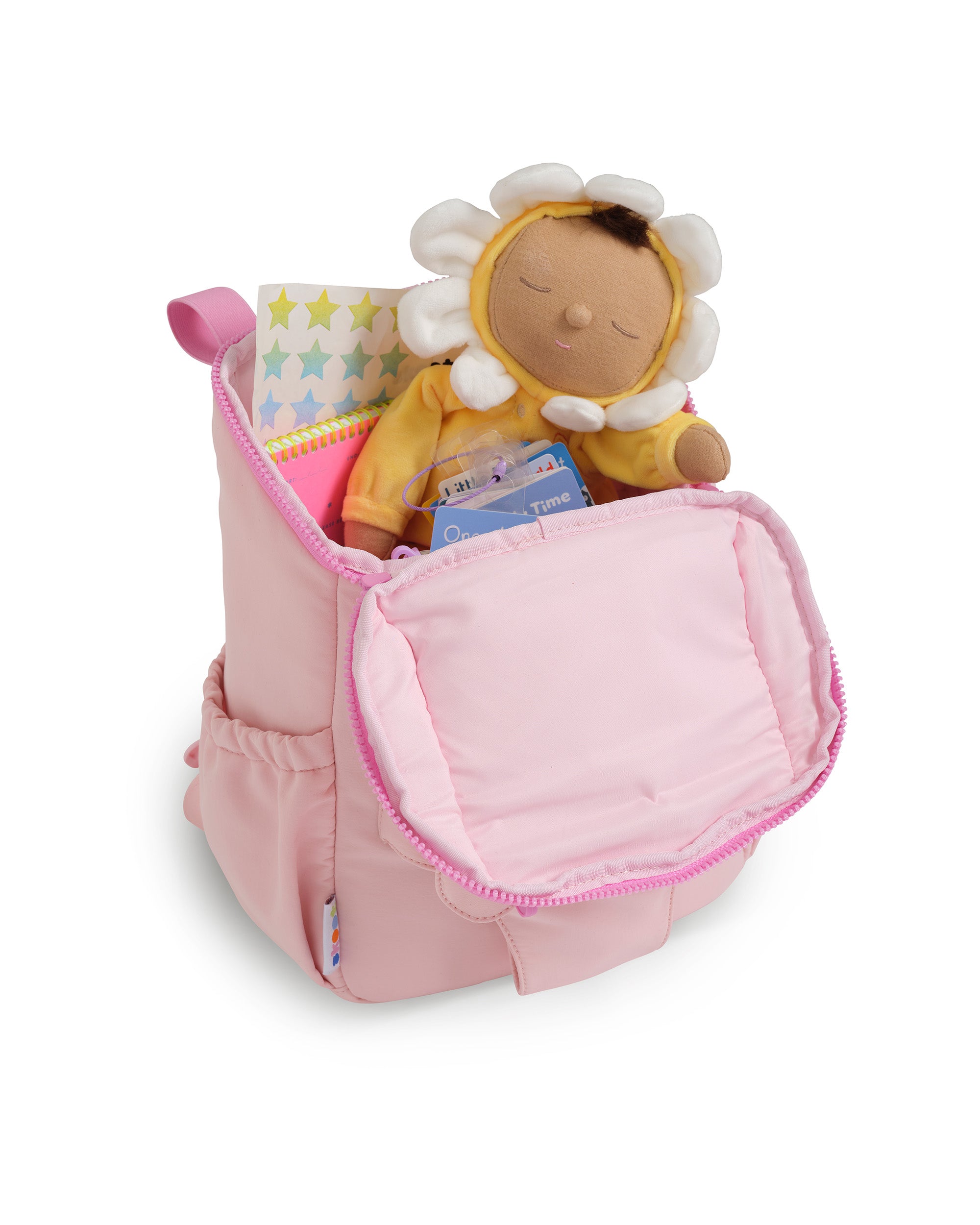 puff Pink skoot toddler backpack with a doll inside on a white background
