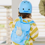 kid wearing skoot sky blue kids helmet